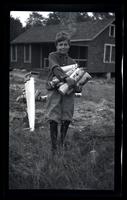 [Elliston Perot Morris Jr. carrying wood], Pocono Lake, [PA] [graphic].