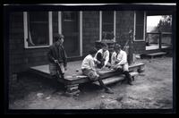 [Elliston Perot Morris Jr. and Marriott Canby Morris Jr. playing on a porch], Pocono Lake, [PA]