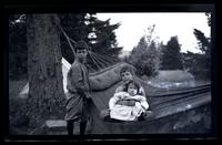 [Marriott Canby Morris Jr., Janet Morris, and Elliston Perot Morris Jr. in a hammock], Pocono Lake, [PA] [graphic].
