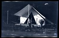 [Marriott Canby Morris Jr. and Elliston Perot Morris Jr. outside a tent], Pocono Lake, [PA] [graphic].