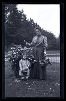 [Jane Rhoads Morris and Janet Morris near rosebush], Rose Time at 131 W. Wal[nut Lane] [graphic].