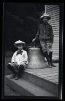 [Marriott Canby Morris Jr. and Elliston Perot Morris Jr. with a large bell], Pocono Lake, [PA] [graphic].