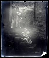 [Woman and children outside a cottage, probably England] [graphic].