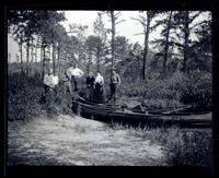 [Group near riverbank], canoeing, Egg Harbor River, NJ [graphic].