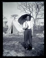 [Boy with an umbrella and a dog], Boys Parlors Camp, Wildwood, NJ [graphic].