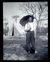[Boy with an umbrella and a dog], Boys Parlors Camp, Wildwood, NJ [graphic].