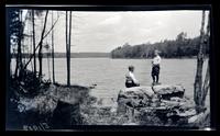 [Man and boy on the lakeshore], Pocono Lake, PA [graphic].