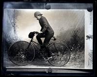 Harry Paiste on his bicycle in a rain storm in the Juras [graphic].