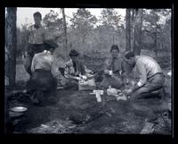 [Men and women around a campfire, Egg Harbor River, New Jersey] [graphic].