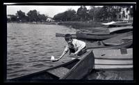 [Elliston Perot Morris Jr. with a toy boat], Sea Girt, NJ [graphic].