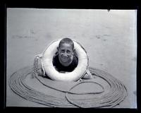 [Boy with an inner tube], Boys Parlors Camp, Wildwood, NJ [graphic].