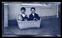 [Elliston Perot Morris Jr. and Marriott C. Morris Jr. in a basket, 131 W. Walnut Lane] [graphic].