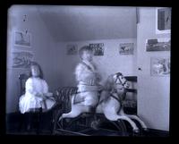 [Interior of a playroom with Elliston P. Morris, Jr. on a rocking horse and Marriott C. Morris, Jr. seated on a chair] [graphic].