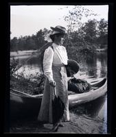 [Jane Rhoads Morris standing near a canoe, Atsion River, New Jersey] [graphic].
