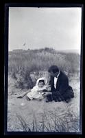 [Marriott C. Morris and Janet Morris among dune grass], Sea Girt, NJ [graphic].