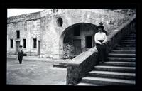 [Woman seated on stone steps] [graphic].