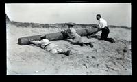 [Marriott C. Morris, Elliston Perot Morris Jr., and Marriott Canby Morris Jr. push a log, Sea Girt] [graphic].