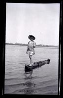 [Marriott Canby Morris Jr. standing on log in water, Sea Girt] [graphic].