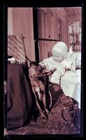 [Janet Morris petting dog, 131 W. Walnut Lane] [graphic].