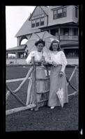 [Two women by rustic fence, Sea Girt] [graphic].
