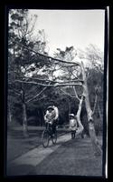 [Marriott C. Morris, Elliston Perot Morris Jr., Marriott Canby Morris Jr. on sidewalk with bicycle, Sea Girt] [graphic].