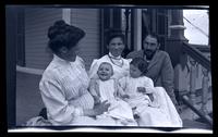 [Ethel Rhoads Potts, Sarah Rhoads Potts, Jane Rhoads Morris, Janet Morris, and Thomas C. Potts on the porch], Sea Girt, NJ [graphic].