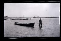 [Man in water pulling boat, Wreck Pond, Sea Girt, NJ] [graphic].