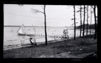 [Woman in chair overlooking dock, Wreck Pond, Sea Girt, NJ] [graphic].