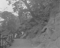 [Three girls on trail, along Wissahickon Creek, Fairmount Park] [graphic].