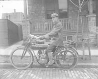 [Man on a motorcycle, The Flying Merkel, in Manayunk] [graphic].
