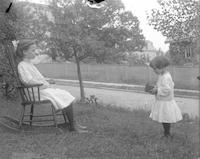 [Elizabeth Berry photographing Alice Berry in a rocking chair, 201 Righter Street, Manayunk] [graphic].