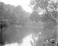 [Group in an "Ajax" canoe on the Wissahickon Creek near Forbidden Drive, Fairmount Park] [graphic].