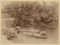 [Two men putting a rowboat in the water] [graphic] / R.S. Redfield.