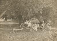 [Children playing on wagon chassis.] [graphic].