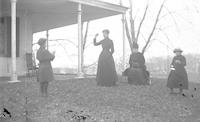 [Anna D. Webster playing ball with her children on Stouton lawn, Philadelphia, Pa.] [graphic].