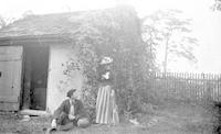 [Bertha T. and Clement B. Webster near the smokehouse, Mount Equity, Pennsdale, Pa.] [graphic].