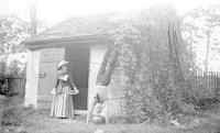 [Bertha T. Webster, standing near a man in a hand stand, Mount Equity, Pennsdale, Pa.] [graphic].