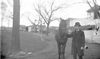 [Clement B. Webster, with horse, on Stouton farm, Philadelphia, Pa.] [graphic].