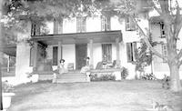 [Four women, including Jane Lownes Webster, sitting on the porch, Lownes Clovercrest Farm, 321 West Woodland Avenue, Springfield, Pa.] [graphic].