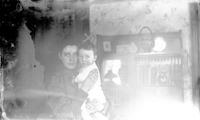 [Jane L. Webster holding baby, Harold S. Webster] [graphic].