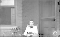[Jane L. Webster sitting on the porch of 4834 Penn Street, Philadelphia, Pa.] [graphic].