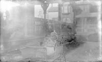 [Lydia Webster sitting in a baby carriage in front of 4834 Penn Street, Philadelphia, Pa.] [graphic].