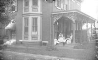 [Mary S. Webster, with Anna D. Webster and children, on porch of 3084 Emerald Street, Philadelphia, Pa.] [graphic].