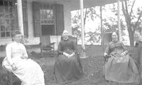 [Three women in rocking chairs on Stouton lawn, Philadelphia, Pa.] [graphic].