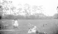 [Walter S. Taylor, with tennis rackets, on lawn of Mount Equity, Pennsdale, Pa.] [graphic].