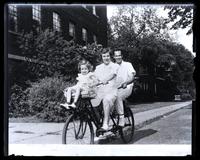 M[arriott] C[anby, Jr.], Libby & Ruth on tandem bicycle, Madison, Wisconsin [graphic].