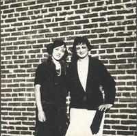 [Unidentified women in front of brick wall] [graphic].