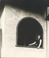 [Unidentified woman sitting on windowsill] [graphic].