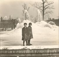 [Two boys in front of the Swann Memorial Fountain in Logan Circle in winter.] [graphic].