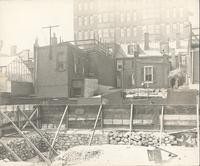 [Stone foundation at construction site and rear of row houses, Philadelphia] [graphic].